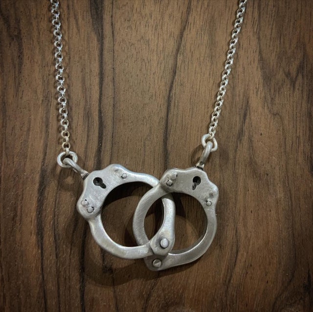 Handcuffed bone necklace deals